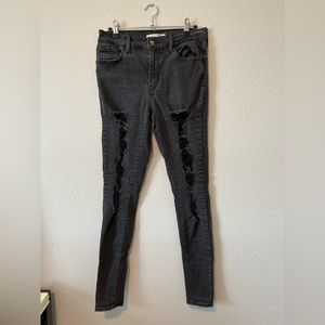 Distressed skinny Levi Strauss jeans